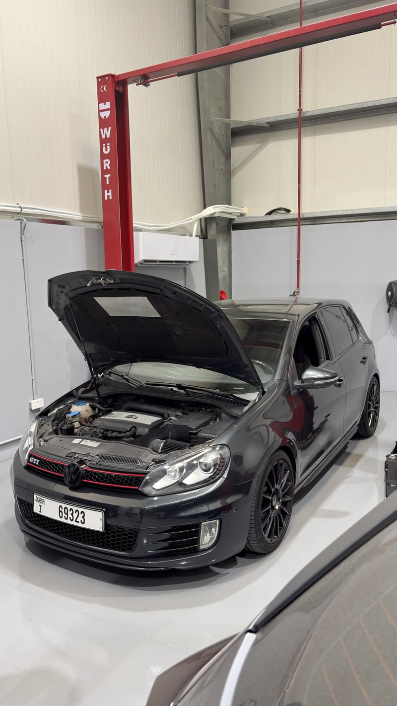 Golf Mk6 GTI with its bonnet open at Wolfsburg Motor Service