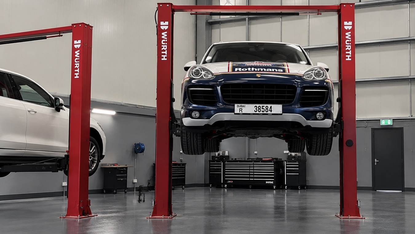 Front view of a Porsche Cayenne on a lift